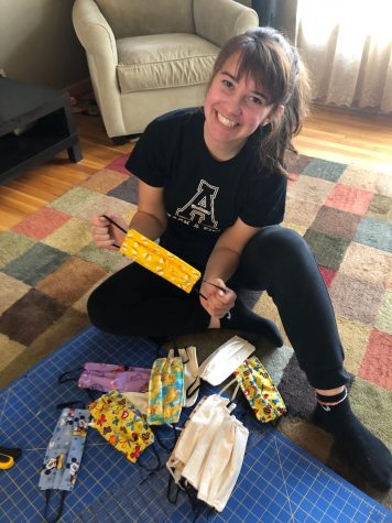 Allison Calek with several of the masks she's made for others during the COVID-19 outbreak.