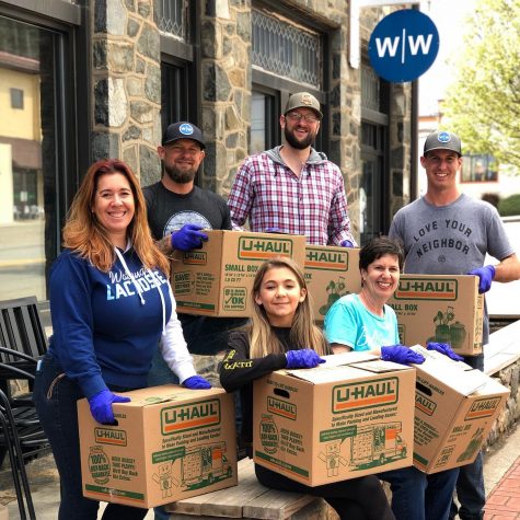Ransom Pub Managing Partner Todd Hendley (third from left), brother Doc Hendley (second from left) and others help the pub package care boxes for the High Countrys service industry workers.