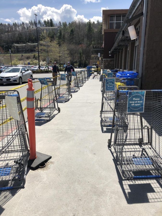 Carts line the entrance to the grocery side of the Boone Walmart. The carts are there to limit the number of people in Walmart at a time. 