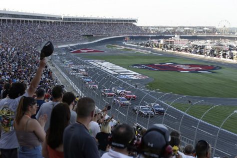 Fans watch as cars race around the track at last years Coca-Cola 600 at the Charlotte Motor Speedway. Gov. Roy Cooper announced that this years Coca-Cola 600 will go on without fans May 24.