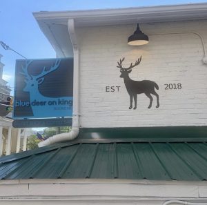 The outside of Blue Deer on King. Customers can see the signature blue deer from its Blowing Rock Location.