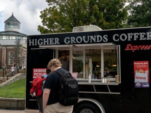 Students wait outside of Higher Grounds Coffee food truck for their orders on Sanford Mall.