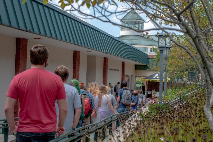 Students wait in line behind the Plemmons Student Union on Wednesday, August 26, 2020.
