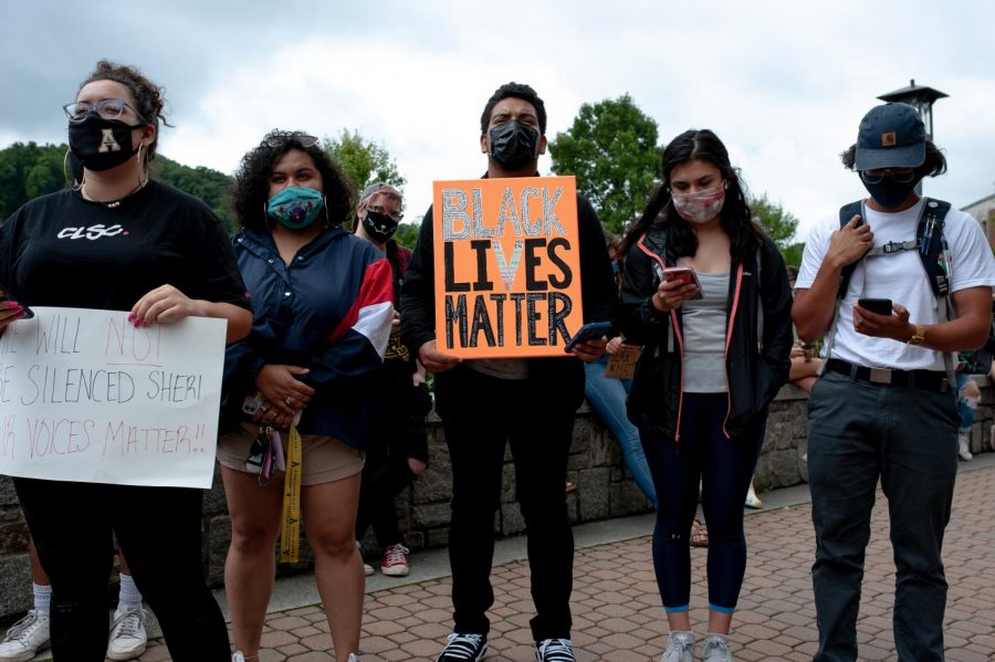Students stand together in support of the march against injustice on Sanford Mall. The event was organized and lead by the Black at App State Collective.