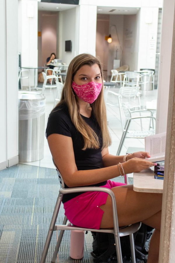 Emma Wright, sophomore, wears a bright pink mask her grandmother made to match her shorts.