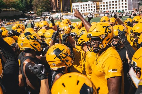 App State players huddle before beating Coastal Carolina 56-37 on Sept. 28. After losing matchups scheduled against Wisconsin, Wake Forest, UMass and Morgan State in 2020, the Mountaineers have added three new non-conference opponents: Charlotte, Marshall and Campbell.