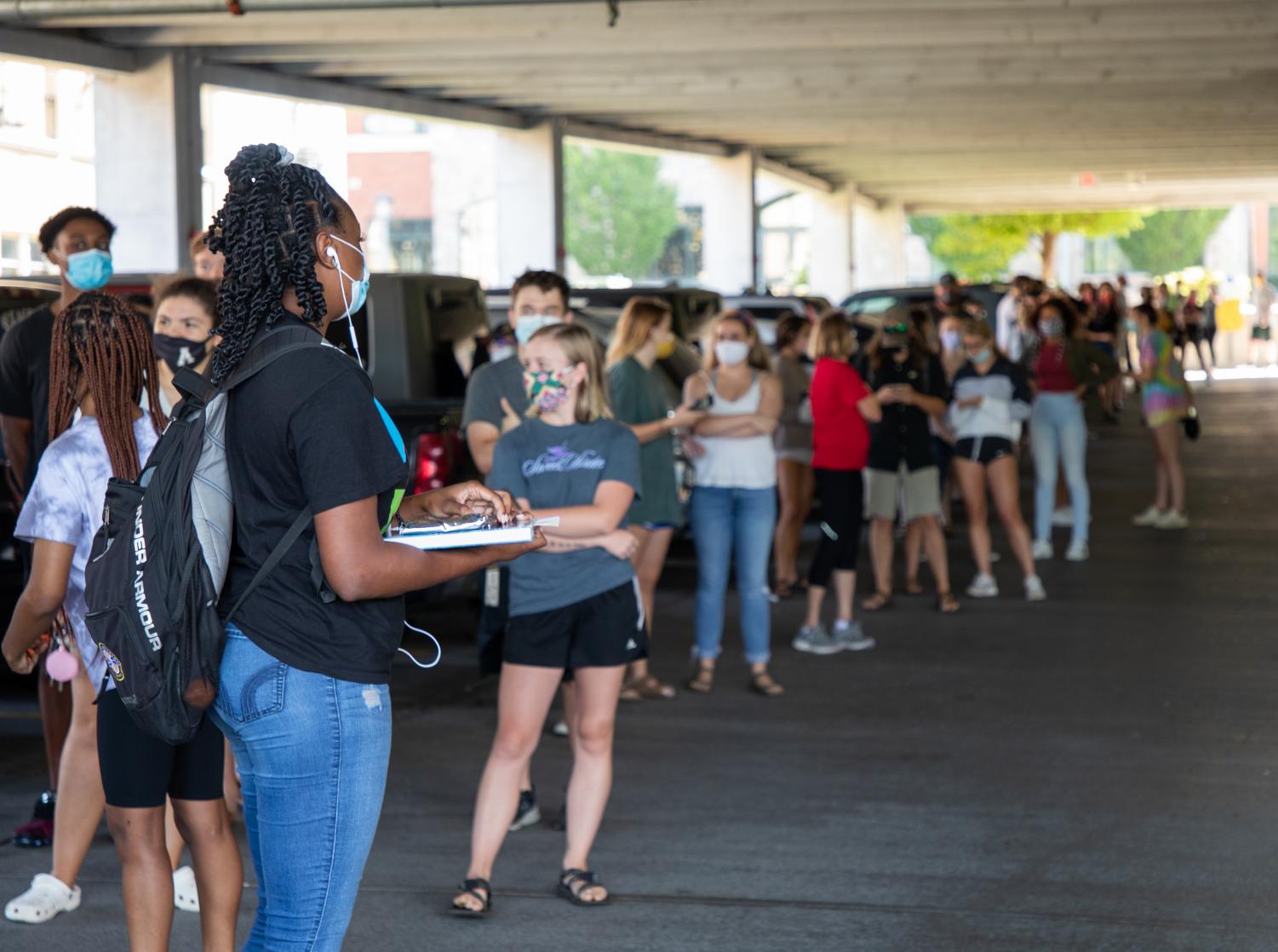 Students wait in line to be tested for COVID-19 in College Street Parking Deck September 2020. 