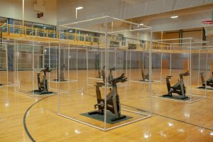 Spin cycles with protective clear plastic for group fitness classes on the SRC gym floor.