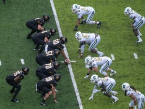 The App State offensive line prepares for a snap in the Mountaineers 35-20 win over Charlotte Sept. 12. Chancellor Sheri Everts announced three active COVID-19 cases associated with the football team on Thursday. 