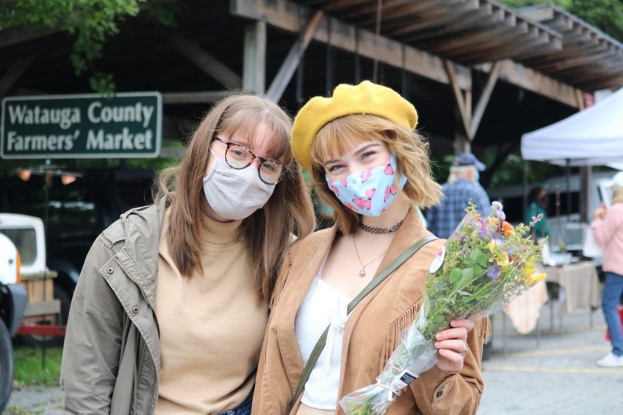 Melanie Vause and Teagan Compton pose at the Watauga County Farmers Market, which brings farmers and artists alike to Boone from May through November. 