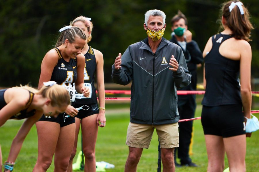 App State head cross country coach Michael Curcio coaches the womens team at the Mountains to Sea Open Oct. 1. The mens and womens teams defeated Marshall in the Blue Ridge Open at the Don Kennedy Trails in Boone Oct. 16. 