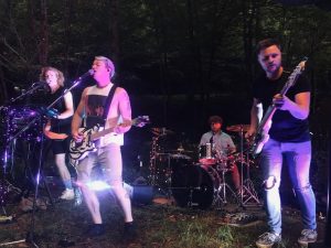 Elec McCready, Isaac McCready, Jackson Valentine and Ryan Wilson performing as American Scream. The band performed their socially distanced outdoor house show on Sept. 8 in an effort to entertain audiences during the COVID-19 pandemic. 