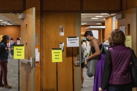 Community members wait in line outside the polling site in the Plemmons Student Union's Blue Ridge Ballroom on Oct. 15 2020, the first day of early voting.