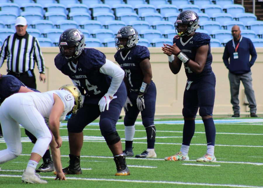 East Forsyth High School offensive guard Jaden Lindsay (No. 74, pictured at left) is a reigning back-to-back 4A state champ. Lindsay committed to App State over Virginia Tech, Tennessee, Charlotte and more. 
