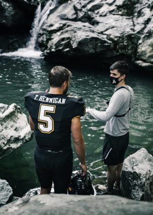 The App State football video team shot a now-viral uniform reveal at Trash Can Falls. The video featured senior wide receiver Thomas Hennigan (left) emerging from underwater. Student Director of Video Production Max Renfro (right) posted the reveal on Tik Tok, where it now has nearly 9 million views.