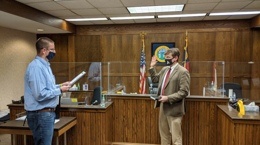Michael Behrent (right) was sworn onto the Watauga County Board of Elections on Oct. 8 as the chair. He replaced former chair Jane Ann Hodges who resigned due to health concerns. 