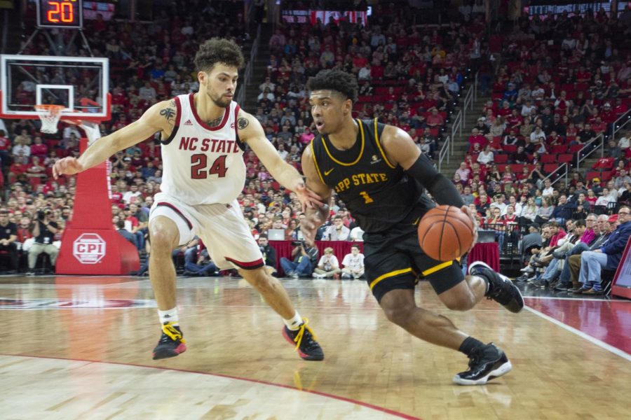 Senior preseason first team all-Sun Belt selection Justin Forrest drives in last years 70-62 loss at NC State. After finishing above .500 last season for the first time since 2010-11, the Mountaineers are looking for more in 2020-21. 