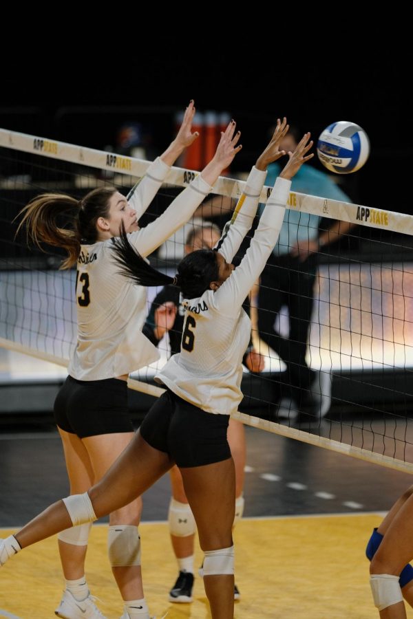 App State seniors Kara Spicer (left) and Grace Morrison (right) make a play during the Mountaineers loss to Coastal Carolina on Saturday. 
