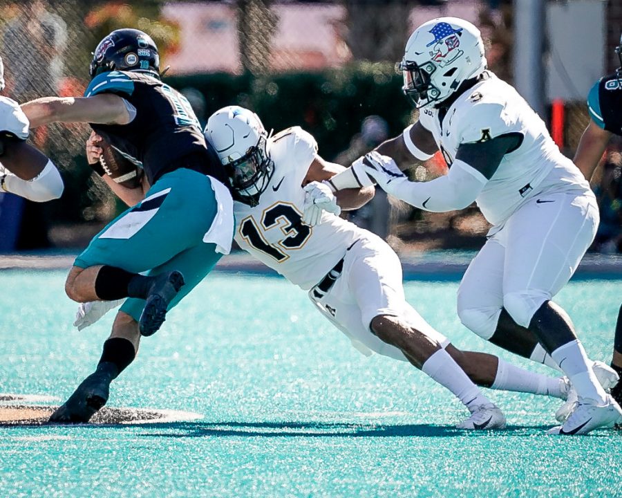App State senior safety Kaiden Smith stretches out for a tackle against Coastal Carolina. The Mountaineers fell to the No. 15 Chanticleers 34-23 in Conway, SC Saturday.