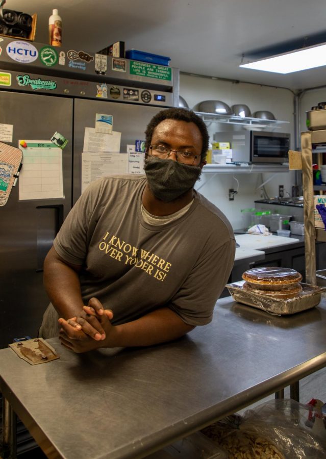 A Boone local and chef for multiple restaurants in the High Country, Ambrose Young looks on to opening his own all-wood barbecue food truck in 2021.