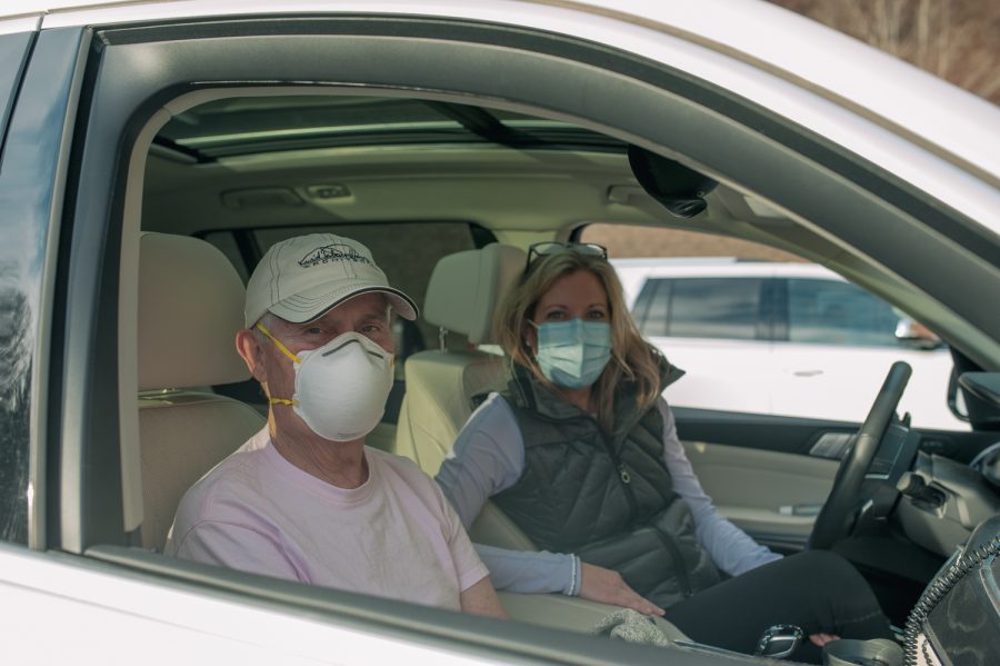 Frank Hancock, an oral surgeon in Boone, and Tara Hancock, wait for his Moderna vaccine dose in the parking lot of AppHealthCare. Tara is not receiving the vaccine on this same day but if she was given the choice she said she would wait for others to go first. Tara said she was there for moral support for Frank.