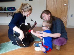 Students with a participant during a music therapy session before COVID-19. Now, the Bachelor of Music in Music Therapy program has taken its program virtual and offers free and remote music therapy. 