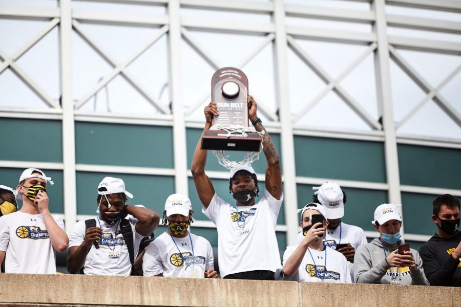 Sophomore forward RJ Duhart hoists the Sun Belt tournament trophy in front of a crowd of Mountaineer faithful. Duhart started at center for the Mountaineers after junior James Lewis Jr. got injured in the quarterfinals. Duhart played a combined 79 minutes in the semifinal and championship rounds, helping his team to its first ever Sun Belt tournament title.