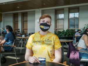 Kale Barns poses with their AppCard. Barns is one of a number of students who would be impacted by legislation that would offer the use of preferred names on AppCards.