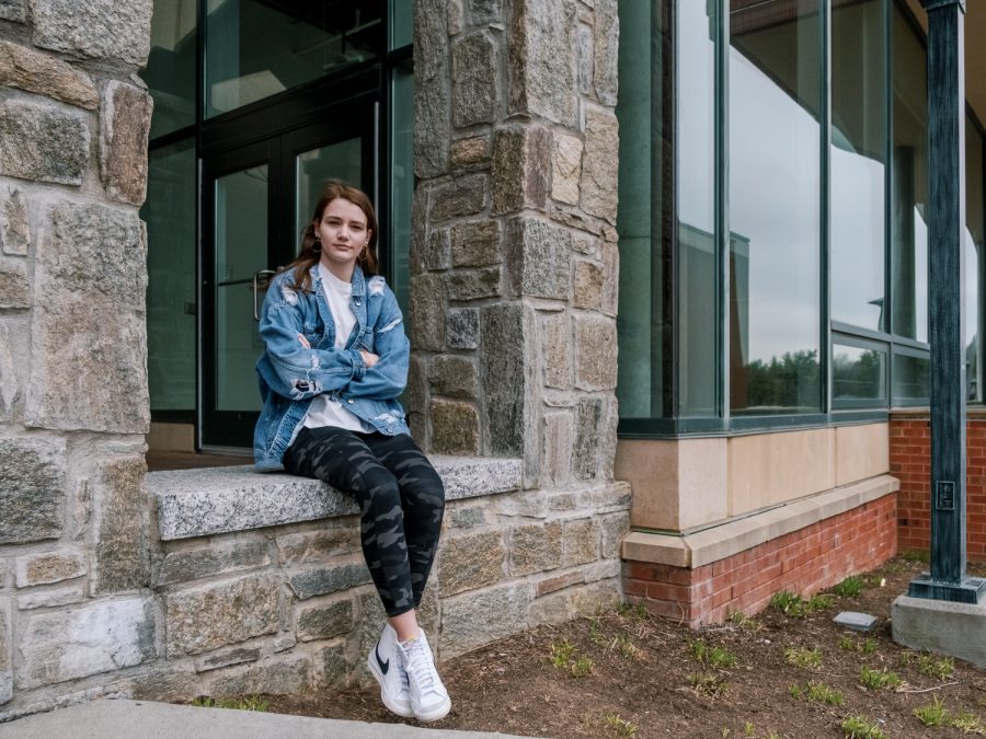 Lillian Schriner, a freshman, poses outside of Summit Hall. Schriner, along with students living in University Housing, are eligible to receive the COVID-19 vaccine.