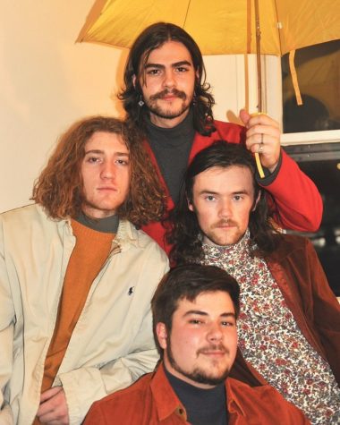 App State students Jake Fain, Ben Burrows, Aaron Huntley and Forrest Britt pose for a band photo. Their band, Dropping Plates, used social media to gain listeners while the pandemic kept them from performing live. 