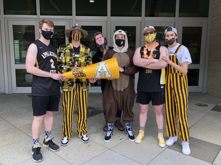 The “Cone Gang.” From the left: Will Strickland, Bailey Lang, “Dusty Korns,” Parker Stone, Andrew Curry and Will Taylor welcomed the App State men’s basketball team home from the Sun Belt championship last week. The crew is invested in all App State sports, and rally online, usually on Twitter, to support university athletics.