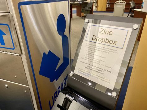 The dropbox for zines in Belk Library beside the service desk. Students have until March 16 to complete a zine and turn it into the dropbox before the library puts them on display.