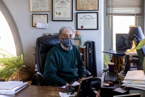 Town council member Samuel Furgiuele, Jr. poses at his desk in his office on King Street. During the pandemic, Furgiuele has attended weekly council meetings over Webex from his office.