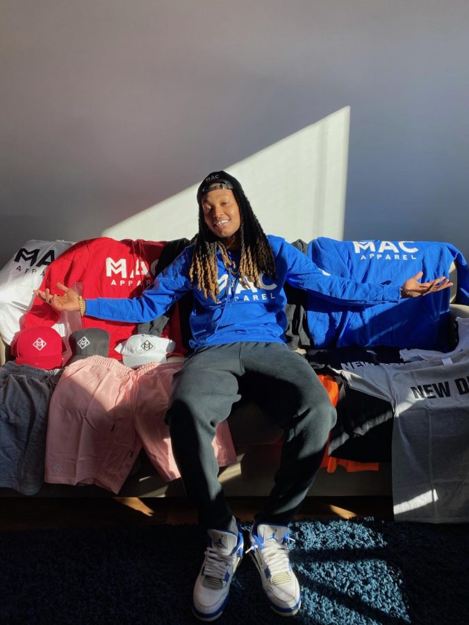 Maya Calder surrounded by clothes from Mac Apparel. Calder said she’s always had an interest in business. 