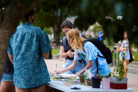 ClimACT set up a table Monday on Sanford Mall. As  students walked by their table they could join the club, pick up free seed or sign a petition. 