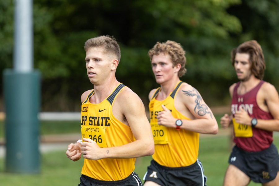 Daniel Smith leads the pack as he runs his way to a 25:15.36 8k personal record at the Firetower Project. Smith next runs at the Live in Lou Cross Country Classic hosted by Louisville Oct. 2.