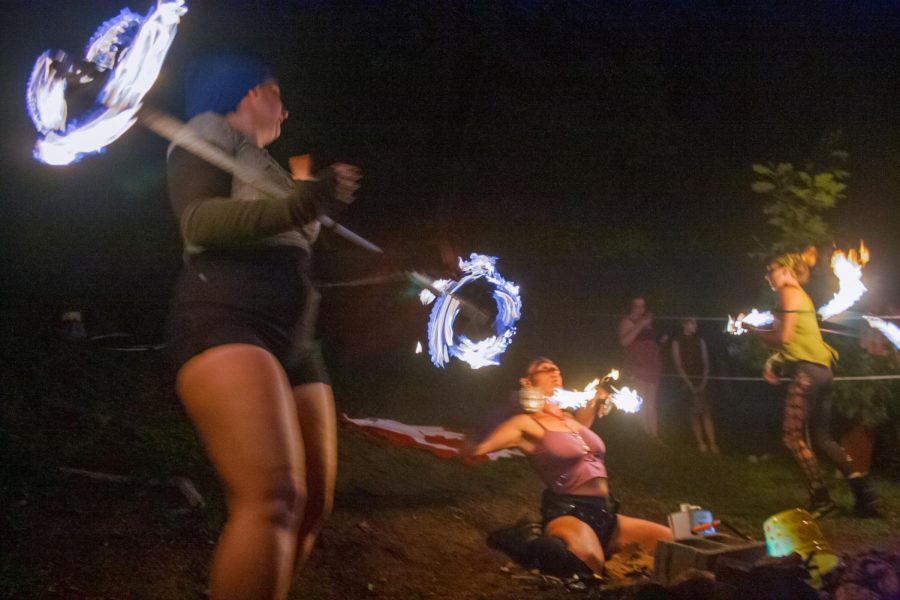 In this long exposure, Inspiral Fire Tribe, a Boone-based fire spinning performance group, showcase their set at Femme Fest, Aug. 26.