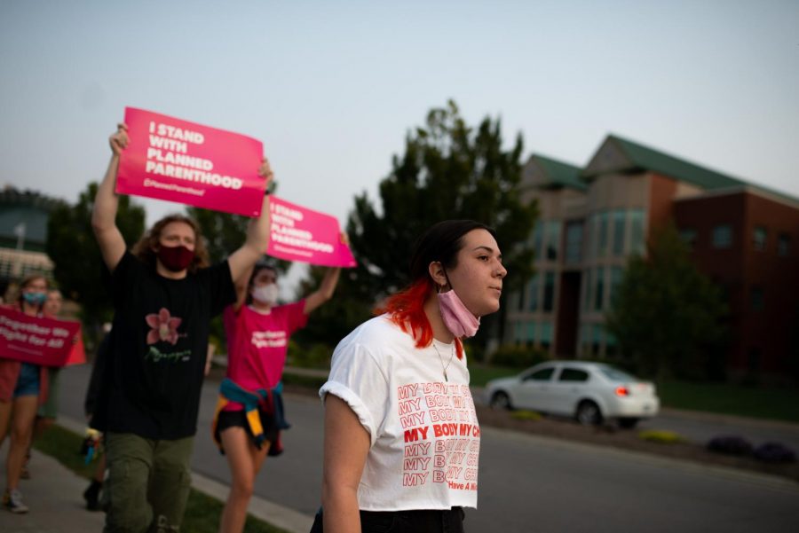  Jillian Mobley, a graduate assistant who works for the Womens Center, organized the march against abortion bans.. Mobley led the crowd through town and facilitated chants.