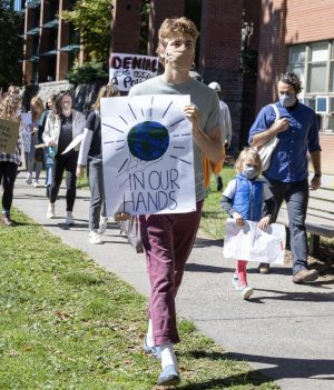 ClimACT and its supporters marched across campus Sept. 24 after attending the board of trustees meeting that day to demand climate action. 
