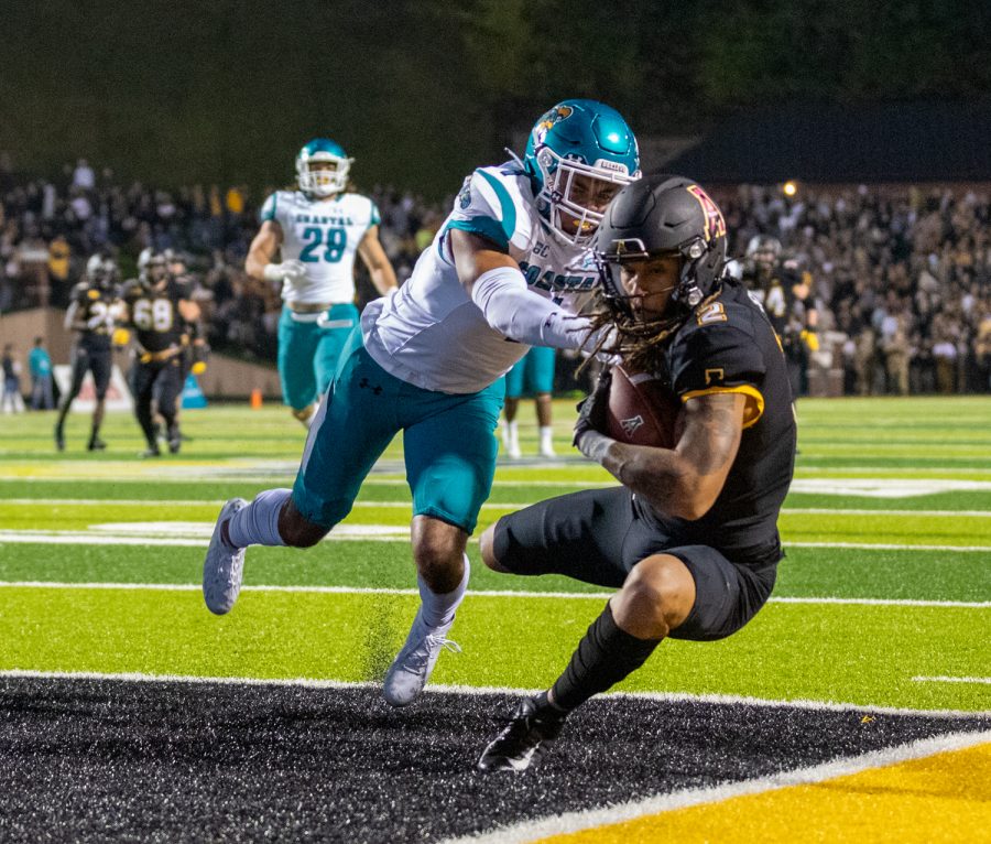 App State wide receiver Cory Sutton scores a touchdown against Coastal Carolina Oct. 20. The Mountaineers went on to upset the No. 14 Chanticleers 30-27 in App State’s second upset win over a ranked opponent, after the 2007 game against Michigan.