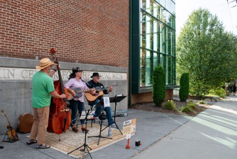 Boone-based trio Wilcox Smith Lane performs outside of the Turchin Center. 