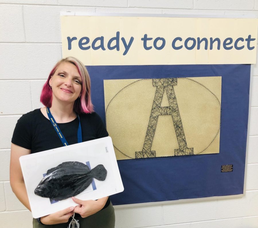 Samantha Strathy, an art teacher at Alexander Central High School, showing off a sample of props purchased for her grant project World Tour Studio Art Outreach: Learning Through Intentional Teaching.