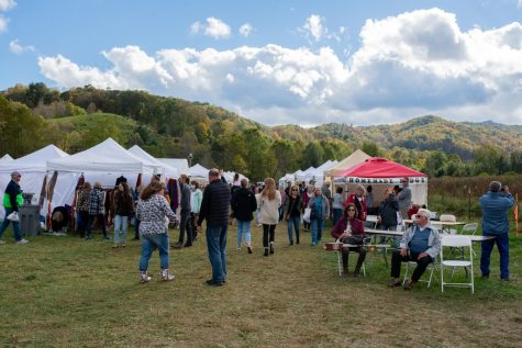 Crowds gather in a field across from Holy Cross Episcopal Church to enjoy vendors, food, and mountain music at the Valle Country Fair on Saturday in Valle Crucis. The Holy Cross Episcopal Church hosted the fair starting in 1979 and host it every third Saturday of October. Vendors are asked to “tithe” 10% of their proceeds to go toward serving nonprofits in the High Country. 