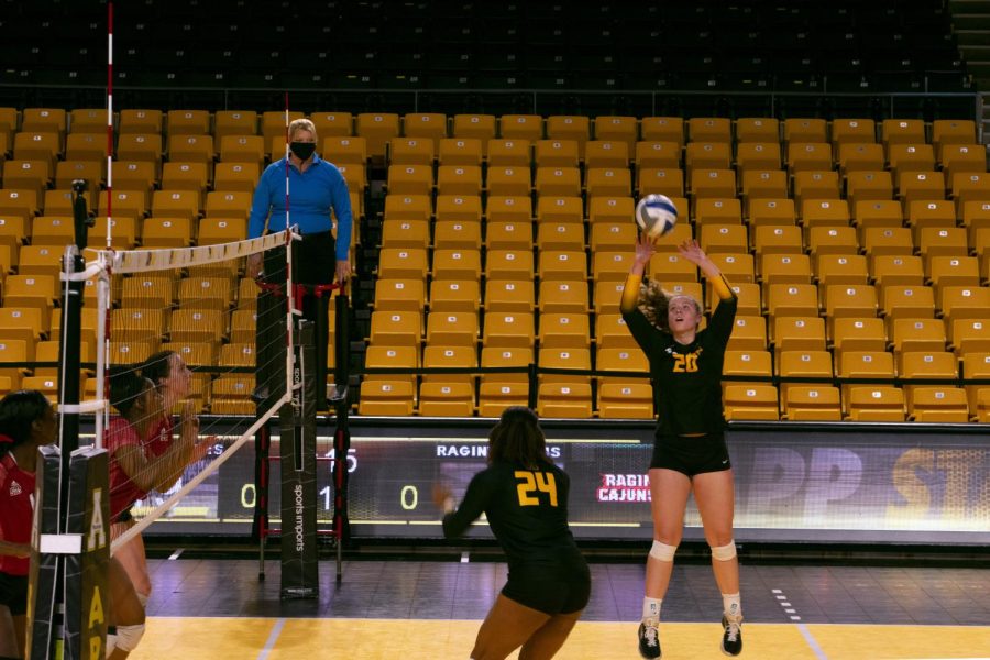 Sophomore+setter+Sophie+Cain+sets+up+senior+middle+blocker+Daryn+Armstrong+for+the+kill.+The+Mountaineers+dropped+both+matches+last+weekend+after+going+2-0+the+weekend+before.+