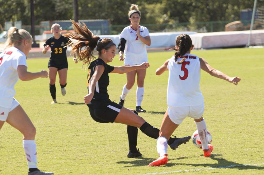 Sophomore forward Isabel Guisasola navigates her way through multiple Arkansas State defenders. Guisasola attempted one of her three shots this season during the match. 