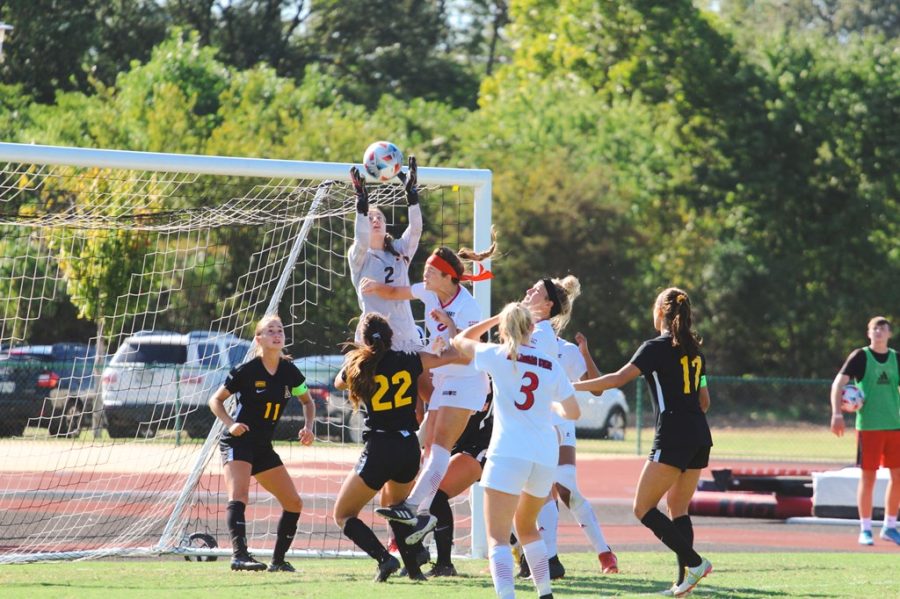 Junior goalkeeper Kerry Eagleston rises up to prevent an Arkansas State score. Eagleston secured seven saves during the match against the Red Wolves.