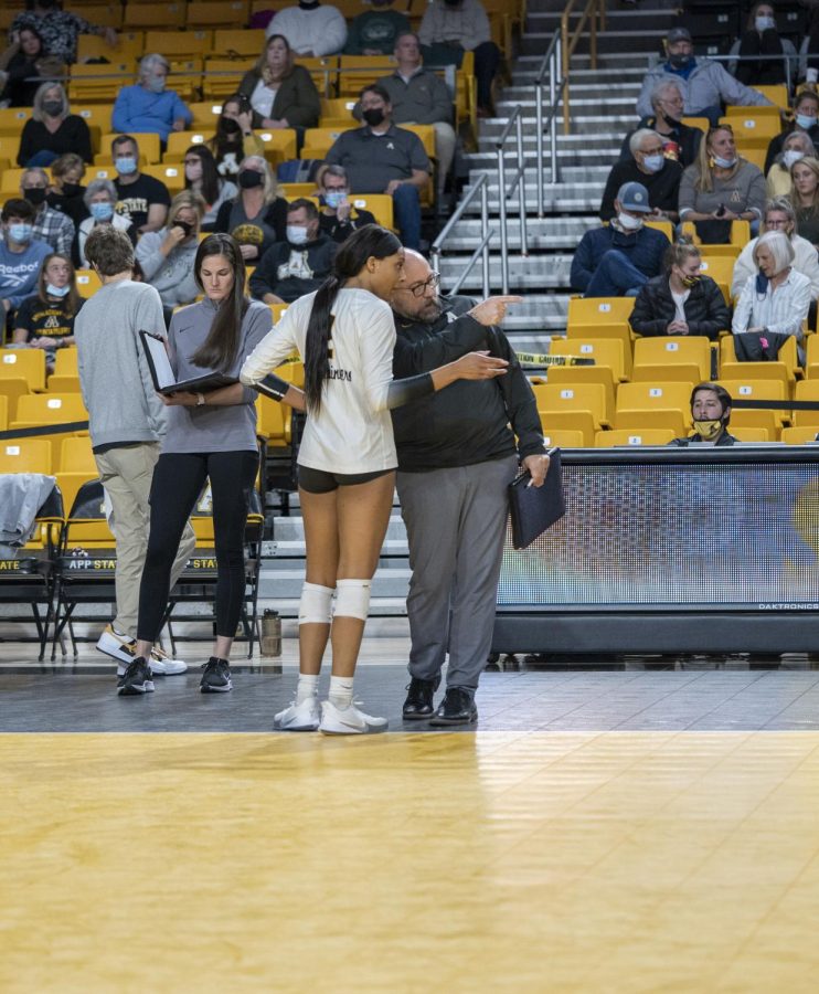 Former head coach Matt Ginipro instructs senior outside hitter Victoria Wilform during App States match with Georgia Southern Nov. 7.