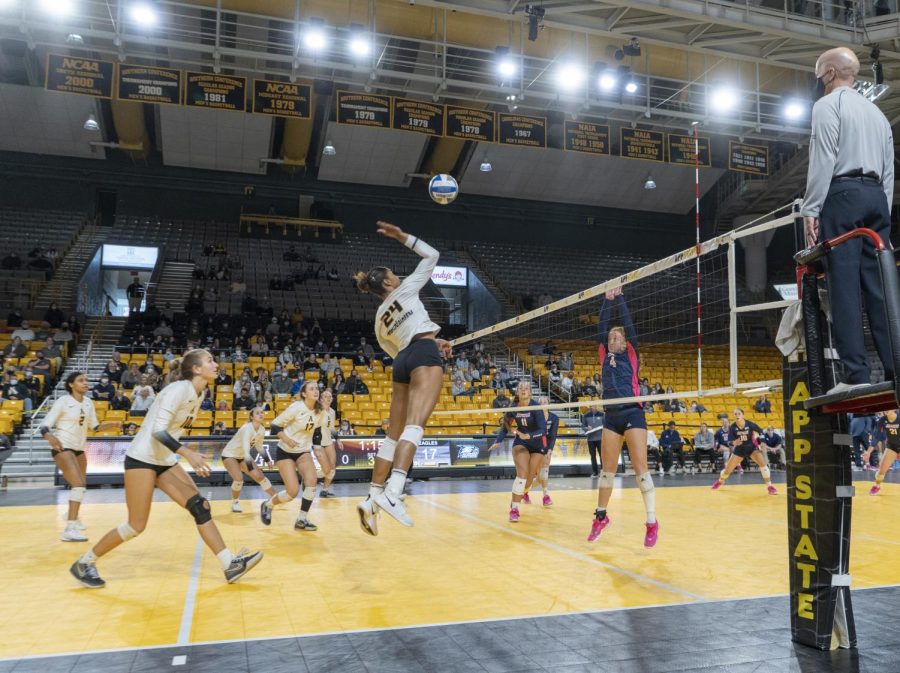 Senior middle blocker Daryn Armstrong strikes the ball against Georgia Southern Nov. 7. The Mountaineers fell to the Eagles 1-3. 