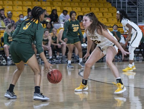 Senior guard Brooke Bigott defends Lees-McRae’s point guard at the top of the key. The Mountaineers forced 32 turnovers against the Bobcats. 