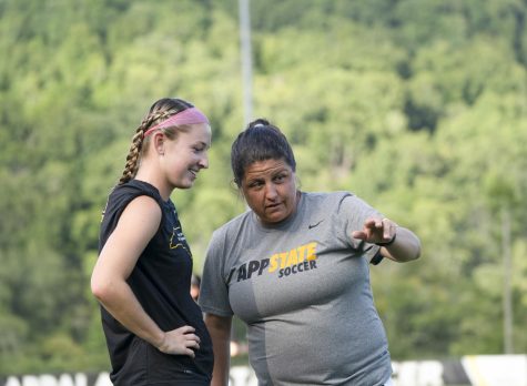 Former head coach Sarah Strickland instructs junior forward Hayley Boyles ahead of App State’s 2-1 win over USC Upstate. Strickland led the Mountaineers to a 7-11-1 record during the 2021 season. 